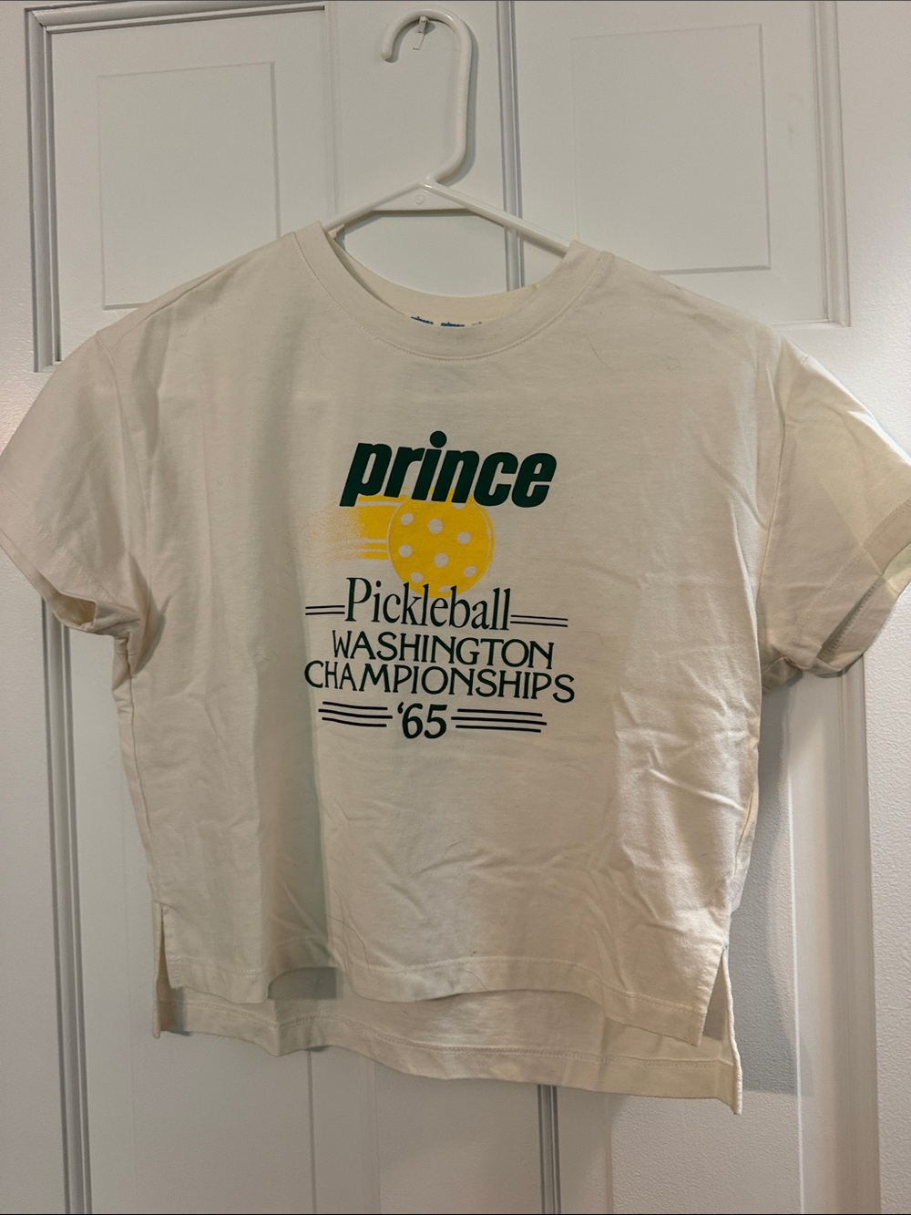 Prince Cream Tee with Green Logo and Yellow Graphic